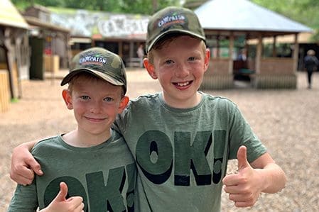 Happy mini-Paintballers with thumbs up